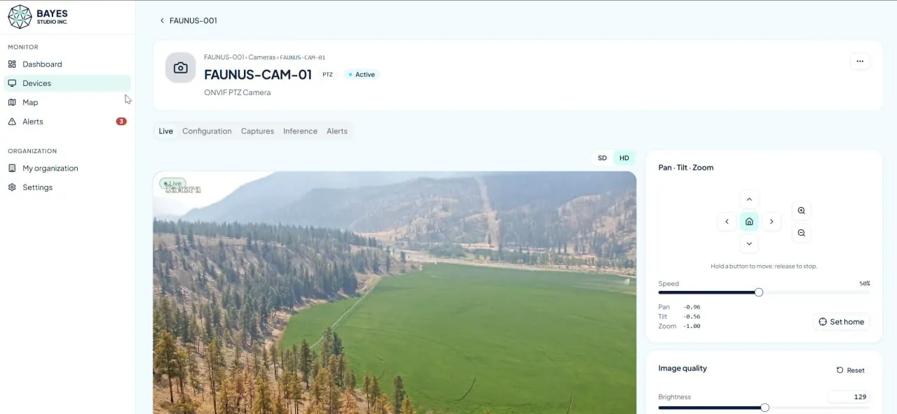 The Bayes control panel showing a live view from FAUNUS-CAM-01, a PTZ camera over a valley of dry grassland and conifers, with pan, tilt, zoom and image-quality controls beside it.